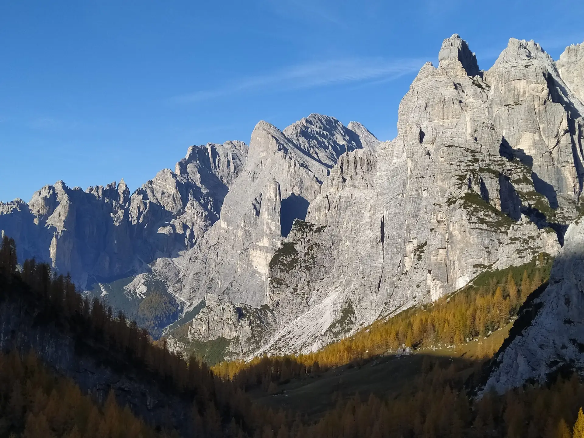 Very tall cliffs of Cima della Busazza and Castello delle Nevere, perfect for base jumping in Dolomites.