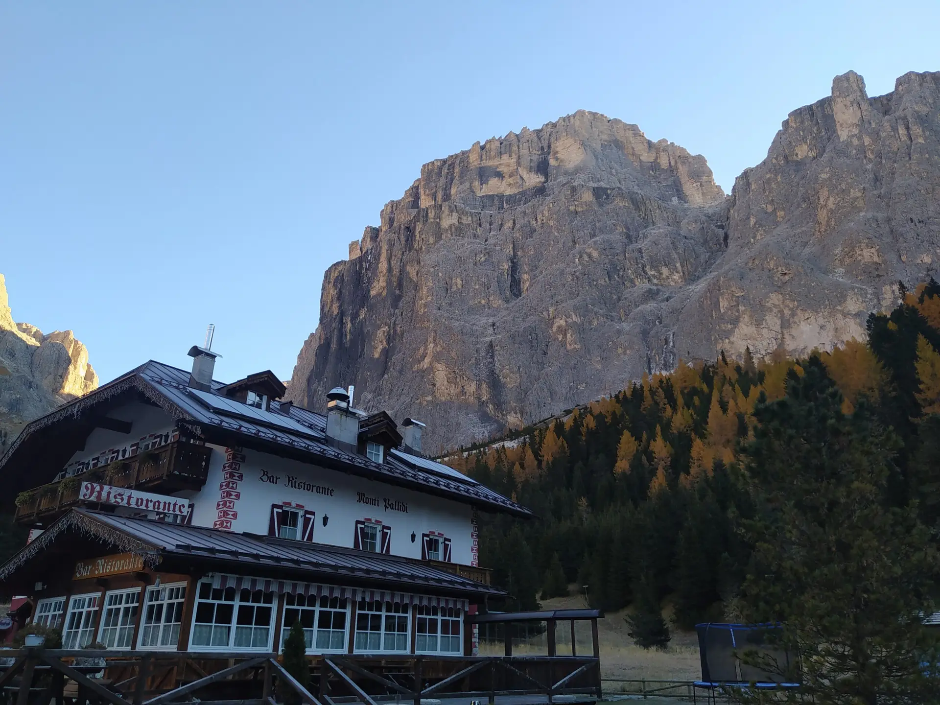 Cliff of Sass Pordoi over the valley restaurant, epic place for base jumping in Dolomites, especially in a wingsuit.