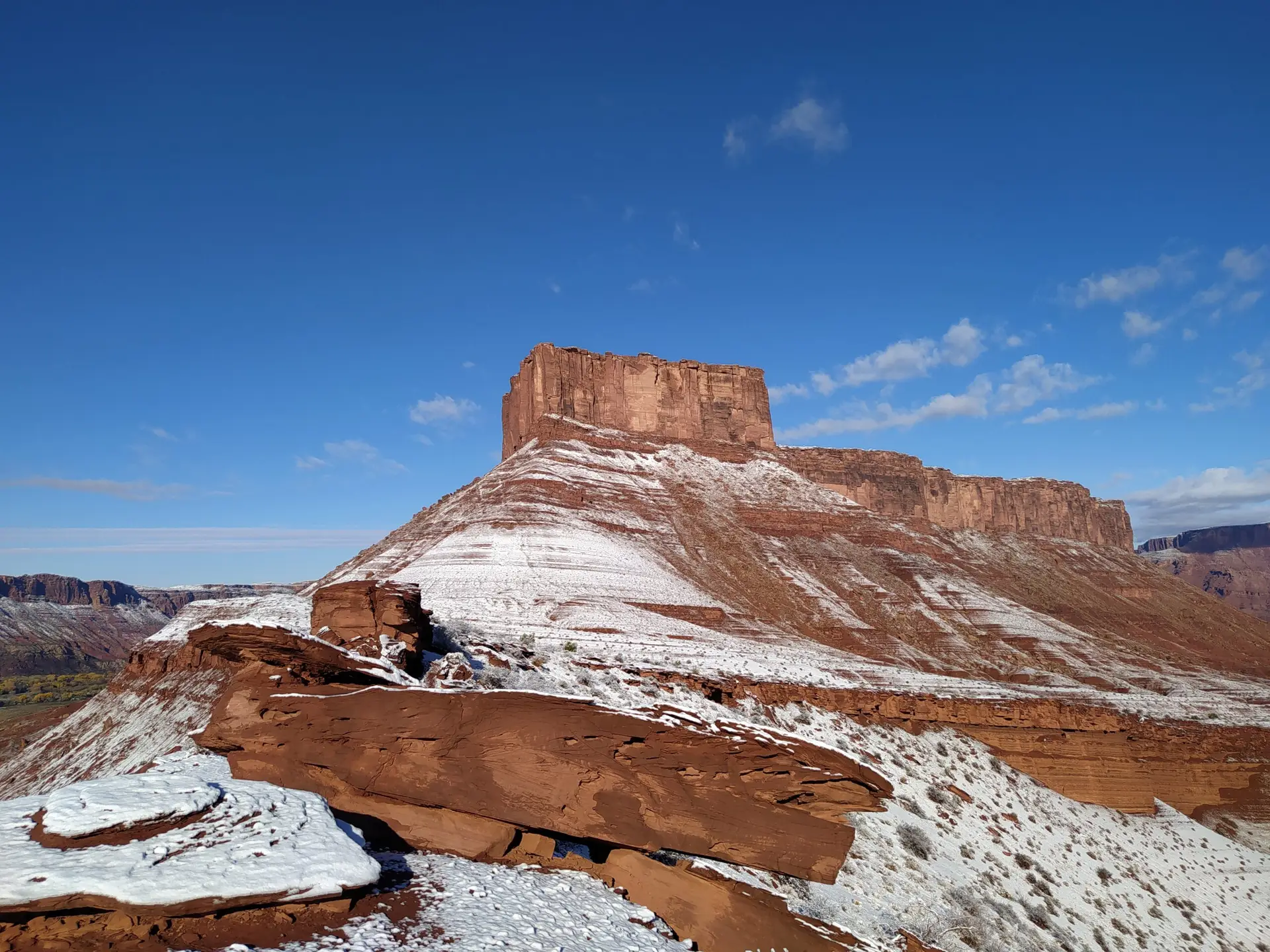 View on Parriott Mesa in Castle Valley, Utah, the talus is dusted with snow. This is an amazing base jumping spot.