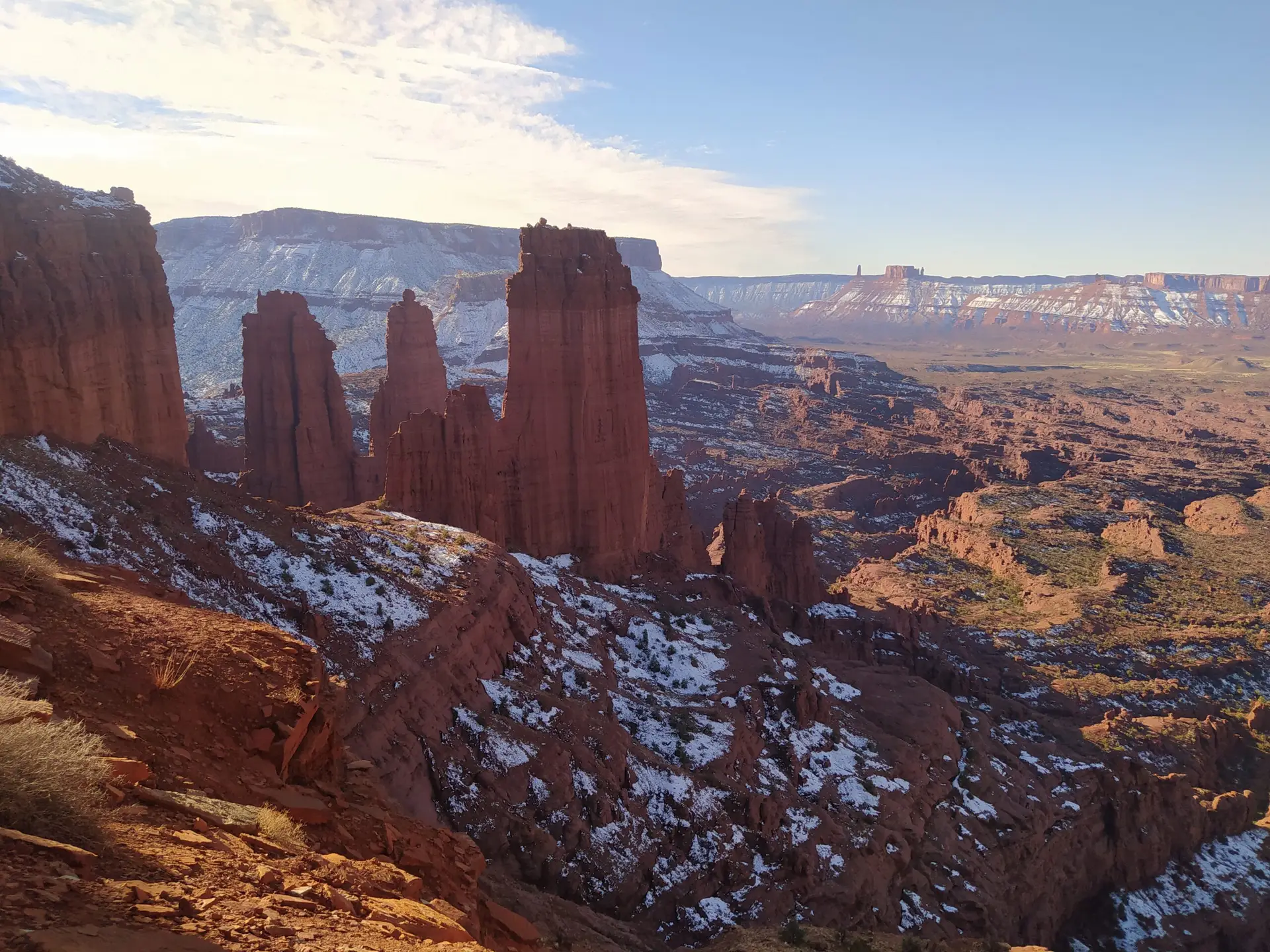 The setting sun casts the shadows of the impressive Fisher Towers on our base jumping expedition in the western USA.